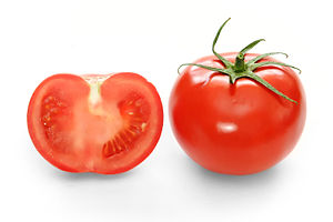 Full and cross-section of a ripe supermarket tomato